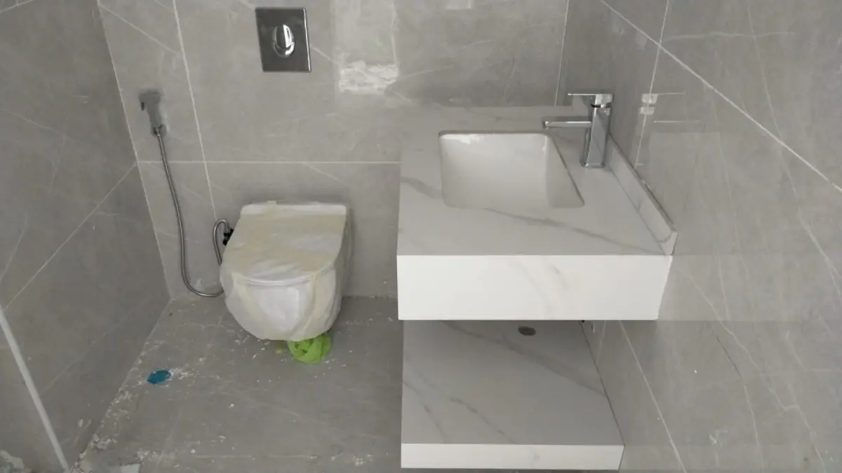 Finished washroom with sink and toilet