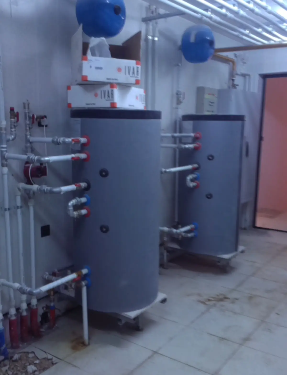 Water tank and pipe connections